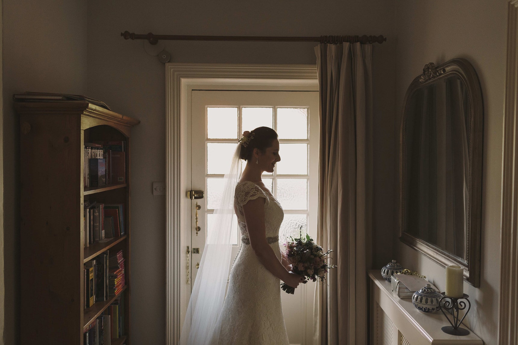 silhouette photo of the bride in her parents house