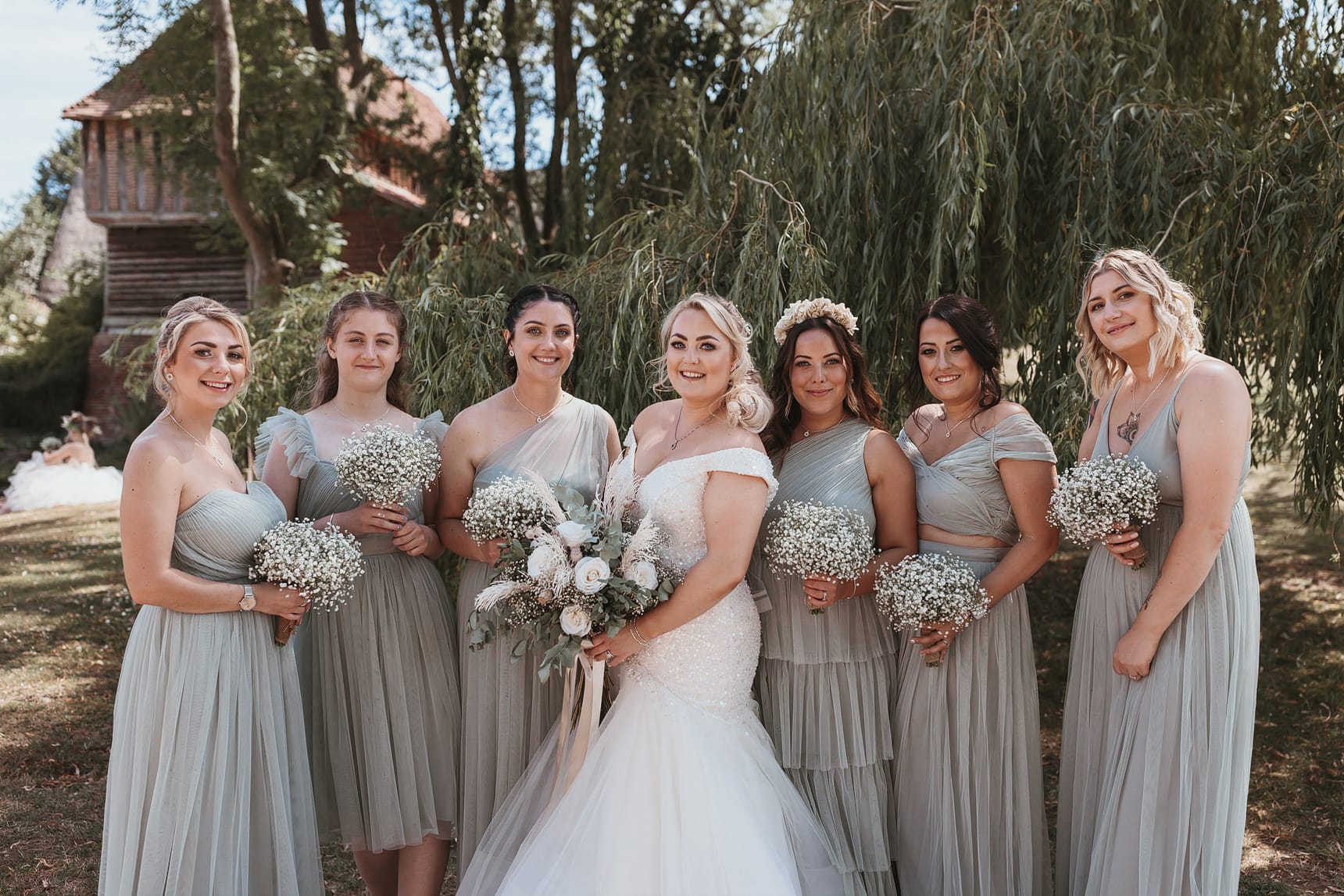 Bridal party photograph in front of a willow tree
