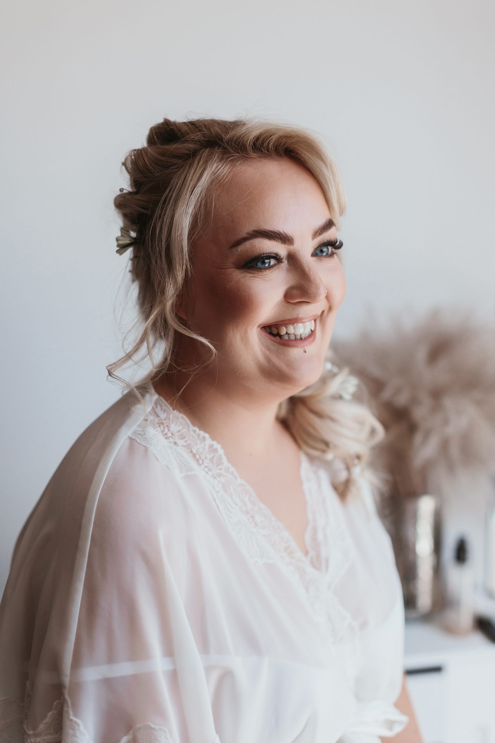 Very happy looking bride after having her make up done